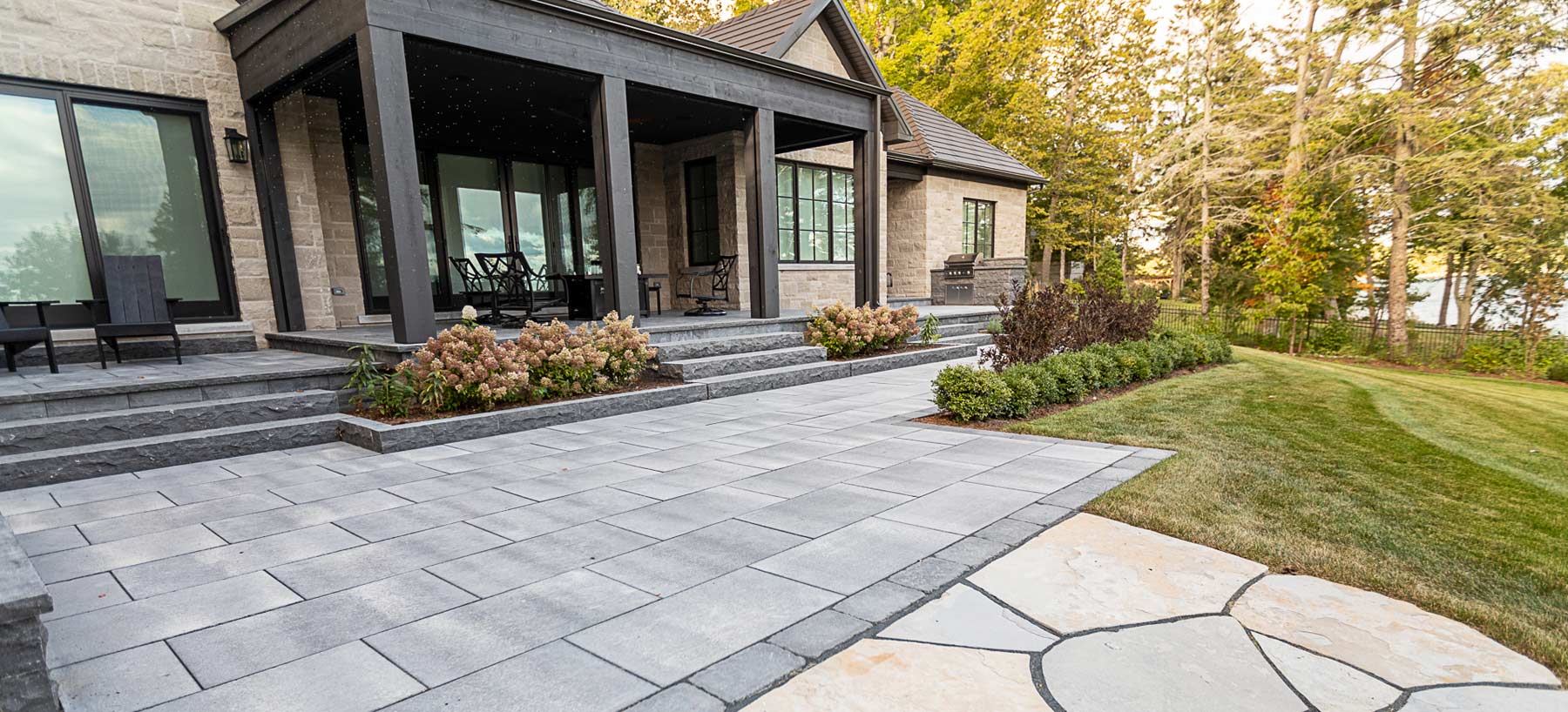 Finished patio and outdoor living space by Shades of Green Landscapes